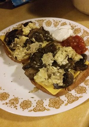 A picture of Mushroom Scrambled Eggs over Toast.