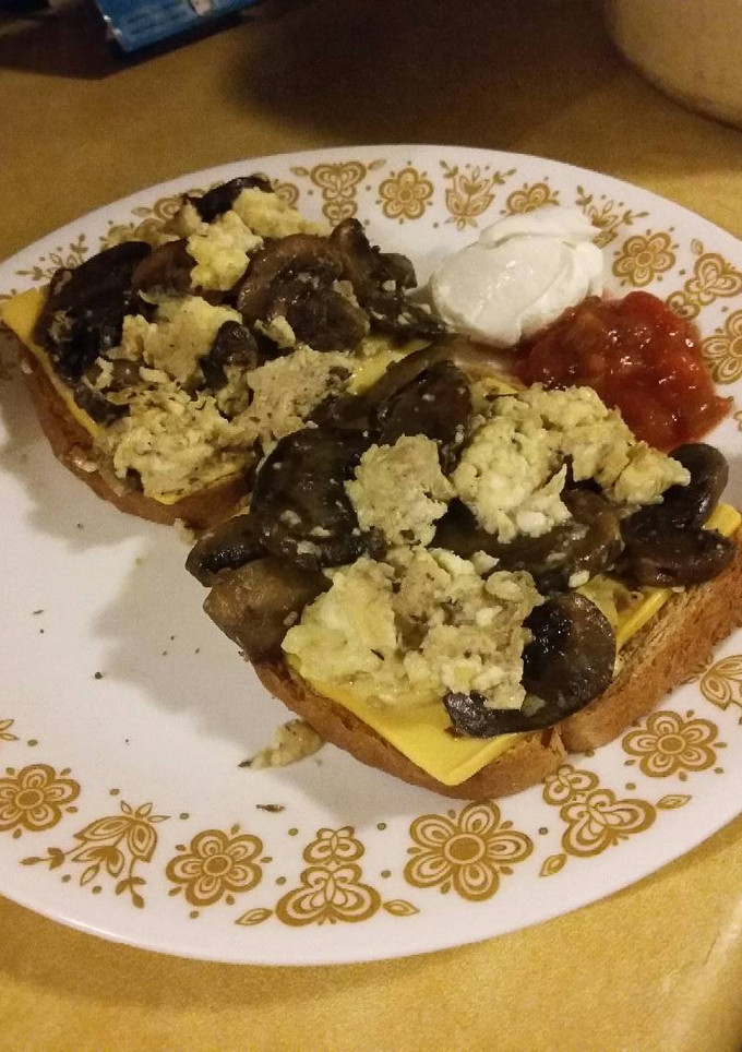 A picture of Mushroom Scrambled Eggs over Toast.