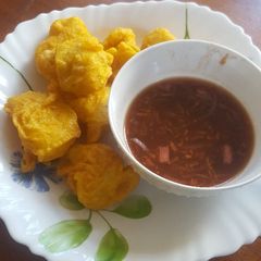A picture of Viazi Karai/hot & sweet tamarind sauce.