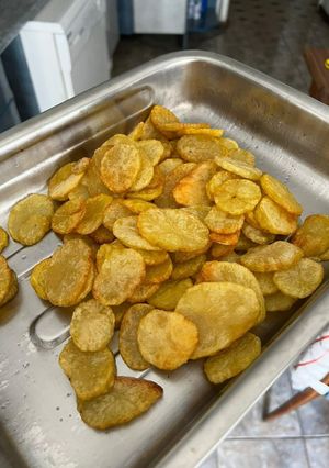 Una foto de Papas fritas en rodajas