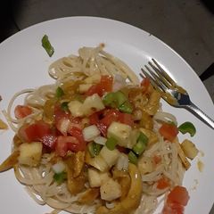 A picture of Spaghetti and chicken strips.
