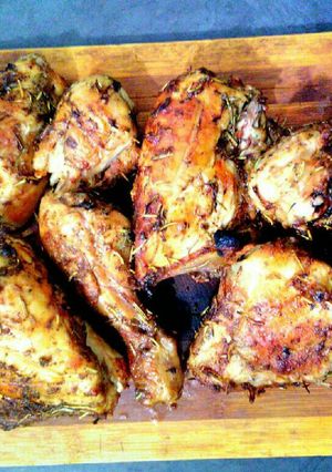 A picture of Spicy herb chicken serve on board.