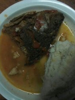 A picture of Fish stew and Ugali.
