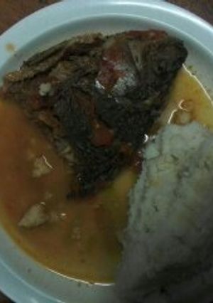 A picture of Fish stew and Ugali.