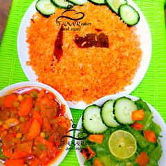 A picture of Cinnamon rice with beef casserole sauce and fattaush salad.