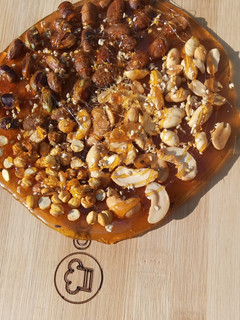 A picture of Mixed nuts chikki pizza (chizza).