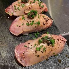 A picture of Tuna and black caviar nigiri sushi.