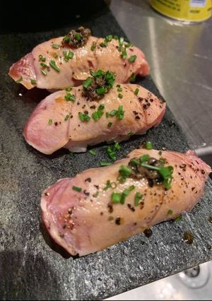 A picture of Tuna and black caviar nigiri sushi.