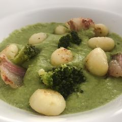 A picture of Crispy Potato Gnocchi with broccoli cream and guanciale.
