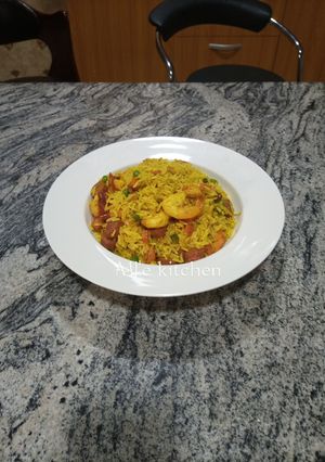 A picture of Fried rice with shrimps and chicken sausage.