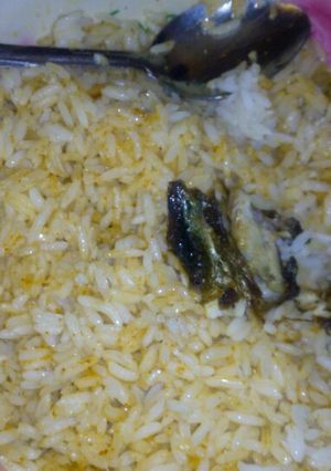 A picture of Rice and smoked fish.