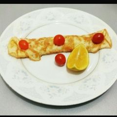 A picture of Omelletes and Cherry Tomato.