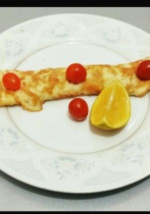 A picture of Omelletes and Cherry Tomato.