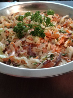 A picture of Cabbage and carrot slaw.