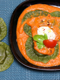 A picture of Spinach Ricotta Ravioli In Tomato Cream Sauce.