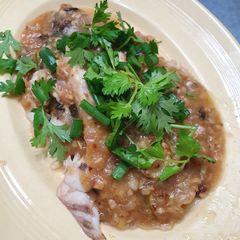 A picture of Fried fish with Thai style gravy.