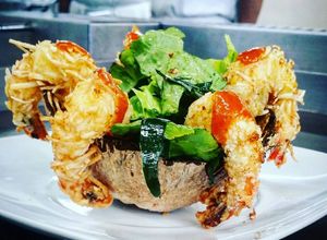 Una foto de Camarones al Coco en Salsa Mango - chipotle