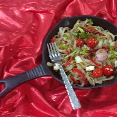 A picture of Rice flate noodles with cherry tomatoes & paneer.