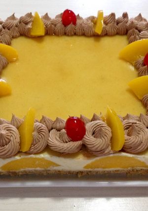 Una foto de Cheesecake de durazno con crema