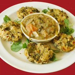 A picture of Vada with fenugreek (methi) leaves, tomato methi dipping sauce.