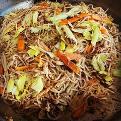 A picture of Filipino Pancit Noodles with Fried Adobo.
