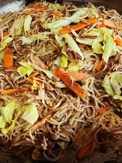 A picture of Filipino Pancit Noodles with Fried Adobo.