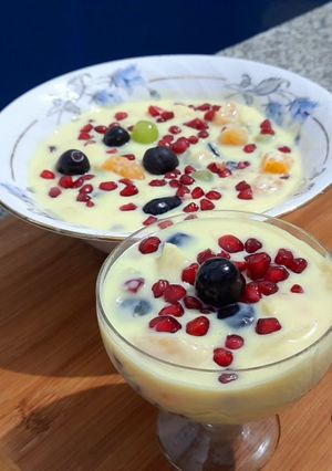A picture of Fruits in custard sauce.