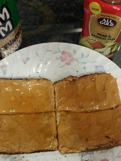 A picture of Peanut butter and jam toast.