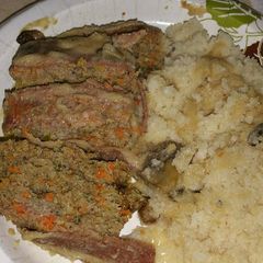 A picture of Bacon-topped Meatloaf with Mushrooms and Gravy.