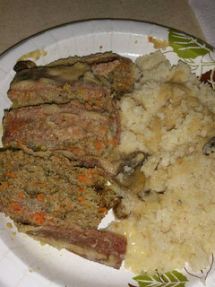 A picture of Bacon-topped Meatloaf with Mushrooms and Gravy.