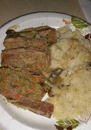 A picture of Bacon-topped Meatloaf with Mushrooms and Gravy.