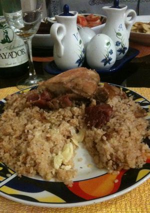Una foto de Arroz con pollo, jamón y queso