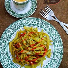 A picture of Thelay walay french fries with illaichi wali chai.