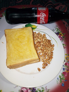 A picture of Buttered Toasted Bread with Peanut.