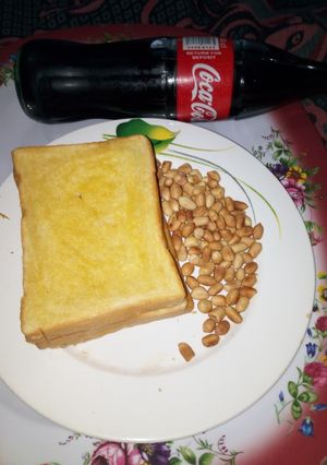 A picture of Buttered Toasted Bread with Peanut.