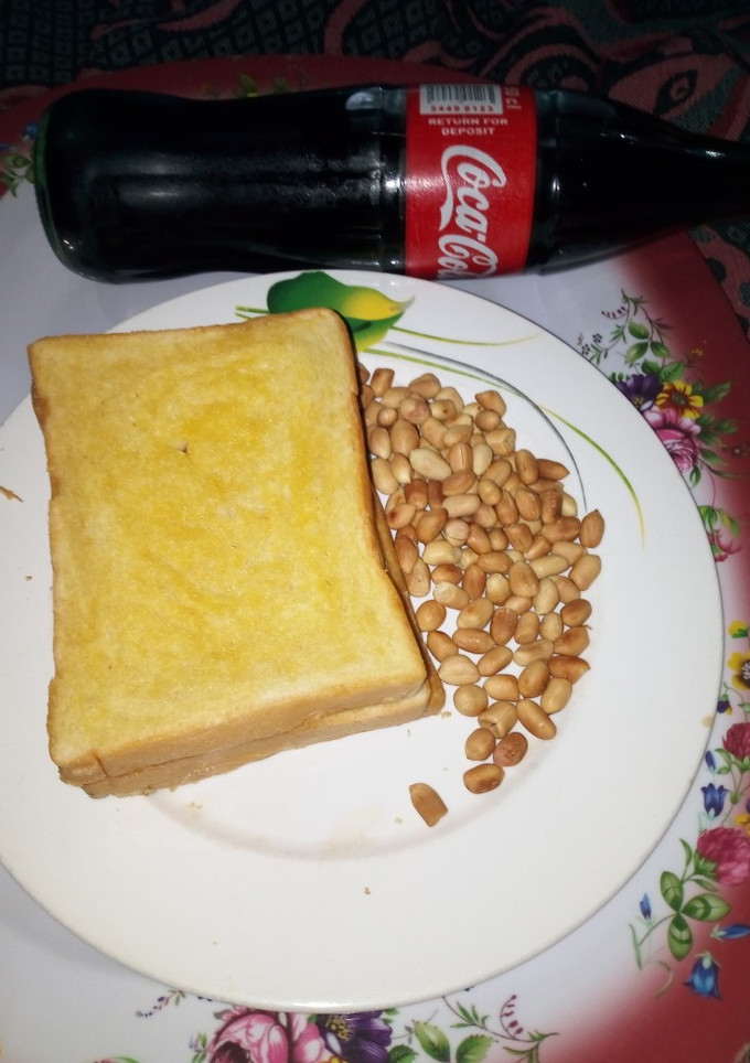 A picture of Buttered Toasted Bread with Peanut.