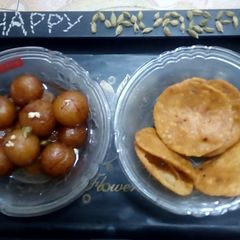 A picture of Gulab Jamun and Rice Crackers.