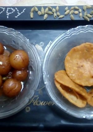 A picture of Gulab Jamun and Rice Crackers.