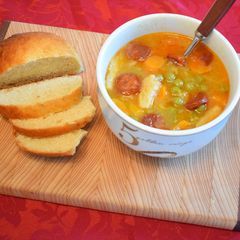 A picture of Pea Soup with pepperoni.