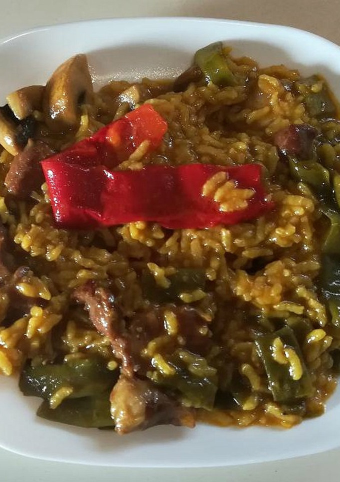 Una foto de Arroz meloso con secreto de cerdo y verduras