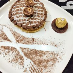 A picture of Ferrero Rocher Cake With Topping Cadbury Chocolate.