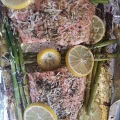 A picture of Baked lemon parmesan salmon Asparagus in foil.