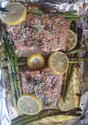 A picture of Baked lemon parmesan salmon Asparagus in foil.