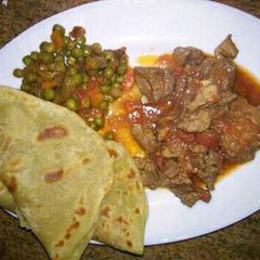 A picture of Chapati and minji with beef stew.