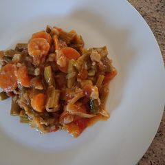 A picture of Asparagus with prawns and carrot.