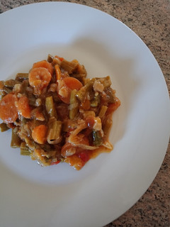 A picture of Asparagus with prawns and carrot.