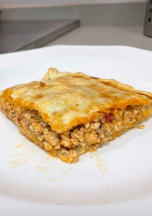Una foto de Empanada de pollo y champiñón