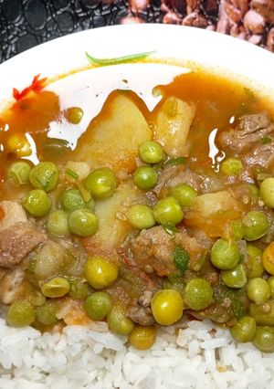 A picture of Beef stew with peas.