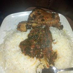 A picture of White rice with miyar ugu.