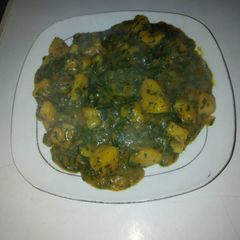 Yam porriage with ugu and uziza leaves A picture of Yam porriage with ugu and uziza leaves.
